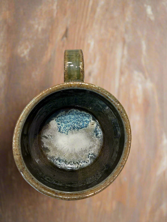 Ceramic mug with ocean design inside